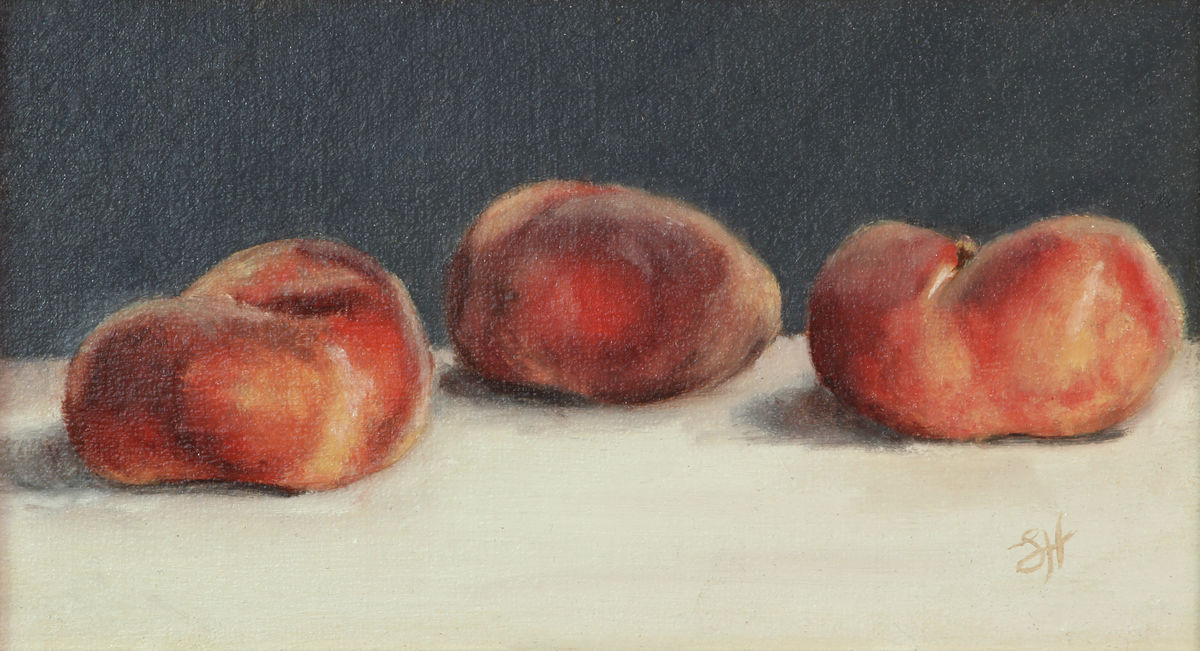 A traditional still life oil painting of three flat peaches on a white piece of linen, signed by Sophie Hall.