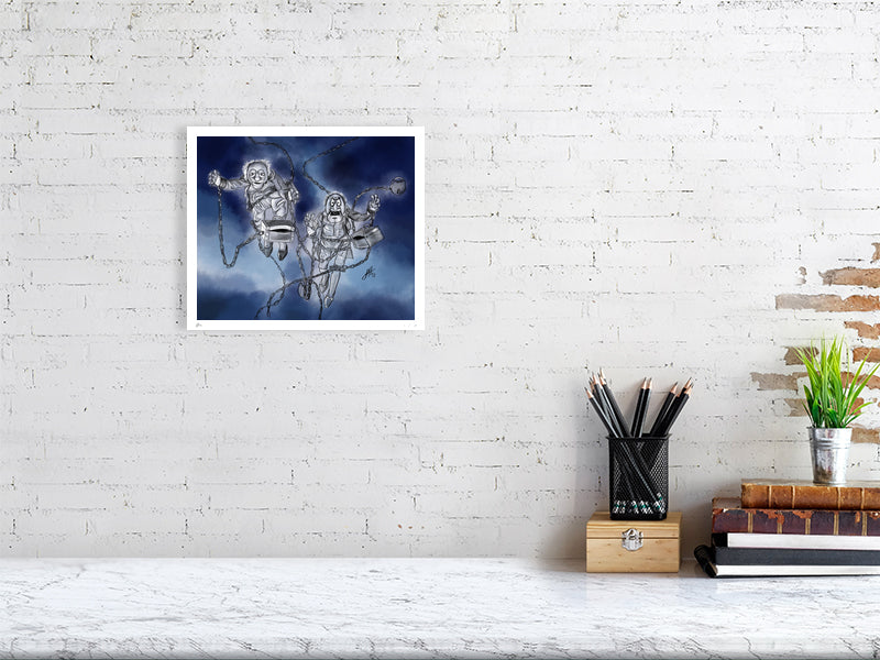 A small unframed print featuring two cartoon characters resembling Marley and Marley from A Muppet Christmas Carol, depicted with chains and flying through a dark sky. Print hangs on a white brick wall.