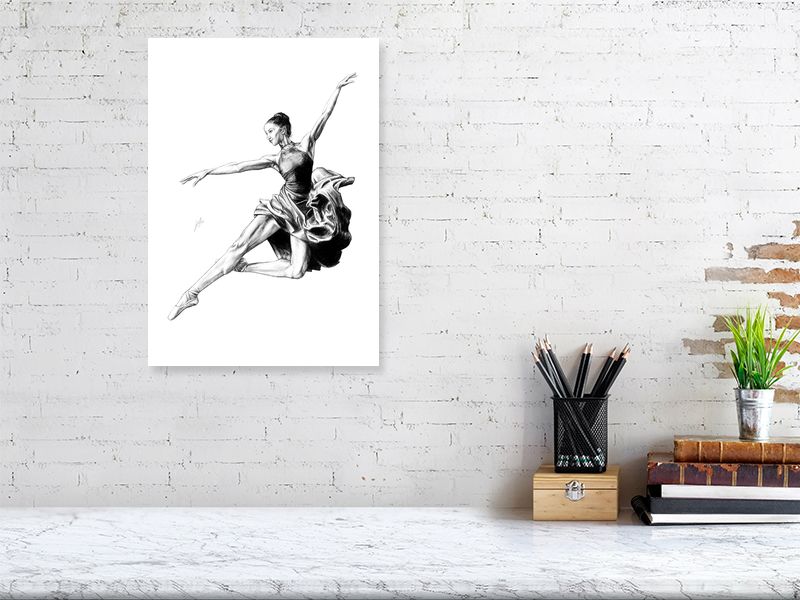 A small unframed pencil drawing of a ballet dancer in mid-jump, hanging on a white brick wall.