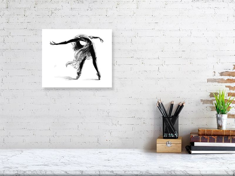 Medium unframed print of a pencil drawing of a ballet dancer mid pose, by Sophie Hall. Print hangs on a white brick wall.