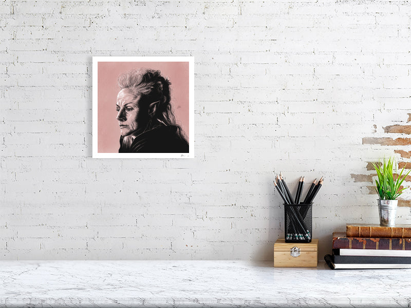A medium size unframed pencil and chalk portrait of Maxine Peake as Titania, on a pink pastel textured background. Hanging on a white brick wall over a desk.