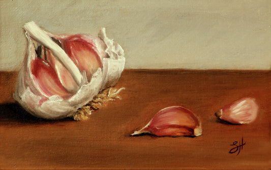 A traditional still life oil painting of garlic bulbs and cloves on a wooden surface, signed by the artist, Sophie Hall.