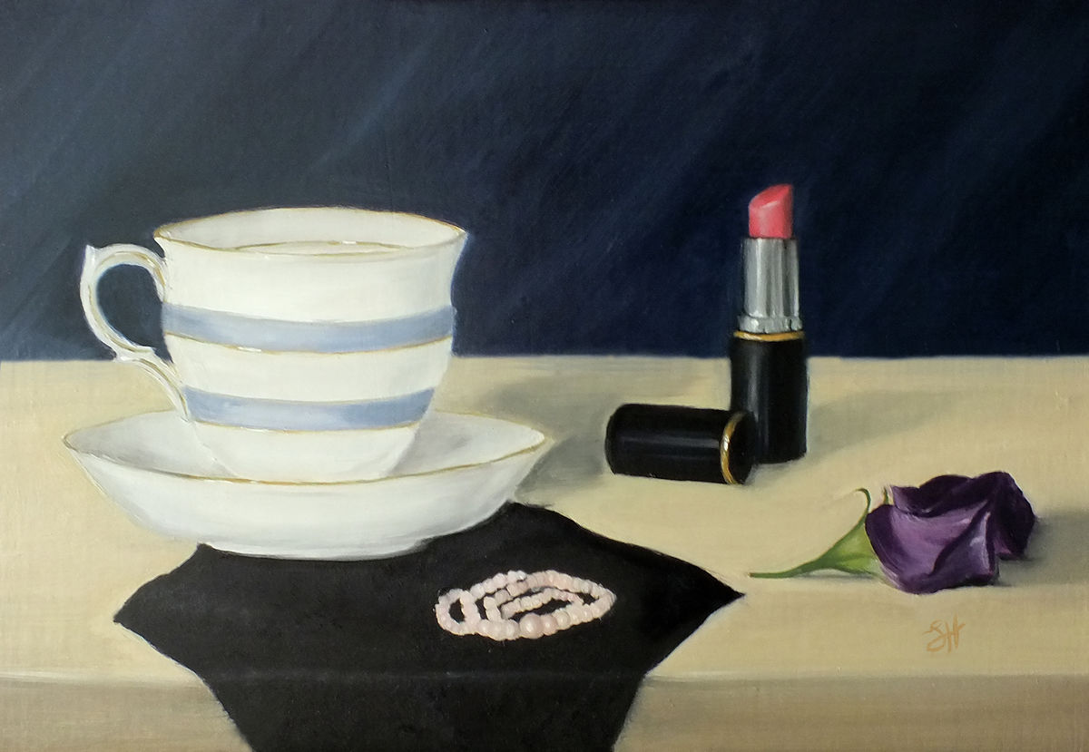 A traditional style still life oil painting scene with a teacup, saucer, lipstick, and a purple flower on a dressing table, signed by Sophie Hall.