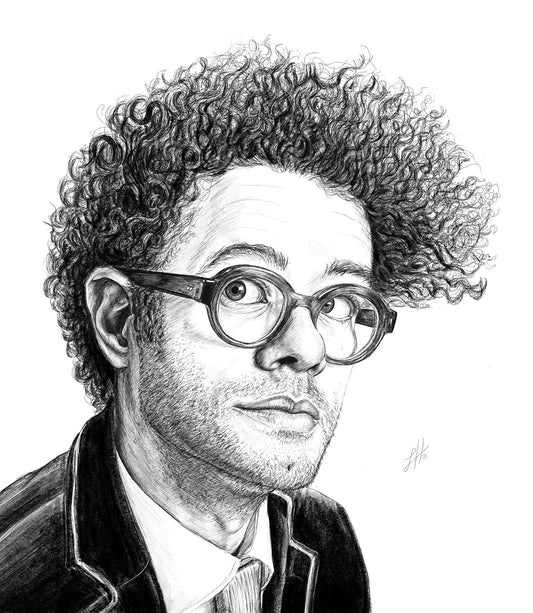 A pencil drawing portrait of Richard Ayoade, featuring him in a suit with curly hair and glasses. Signed with Sophie Hall's monogram.